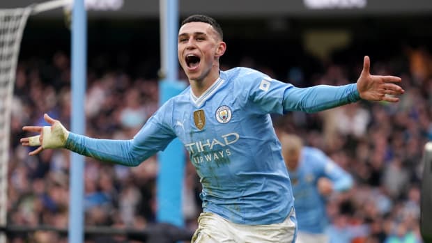 Phil Foden pictured celebrating after scoring two goals for Manchester City in a 3-1 win over Manchester United in March 2024